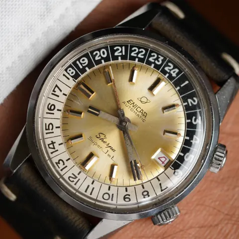 Sherpa Super-Jet with a champagne sunburst dial and black and white 24-hour bezel on a dark strap