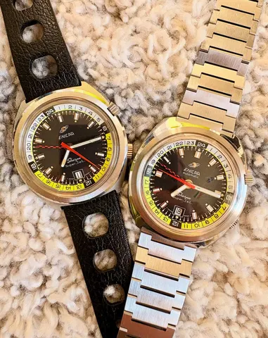 Two Sherpa Super-Jets in the cushion case with black dials and black, white and yellow 24-hour rings, one on a black rally strap and one, an automatic, on a steel bracelet