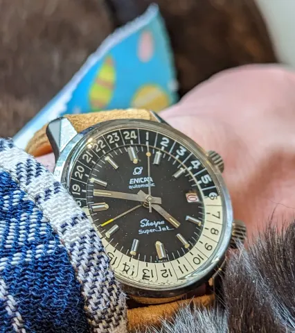 Sherpa Super-Jet with a dark brown dial, yellow-tipped GMT hand and cream and black 24-hour bezel on a tan strap