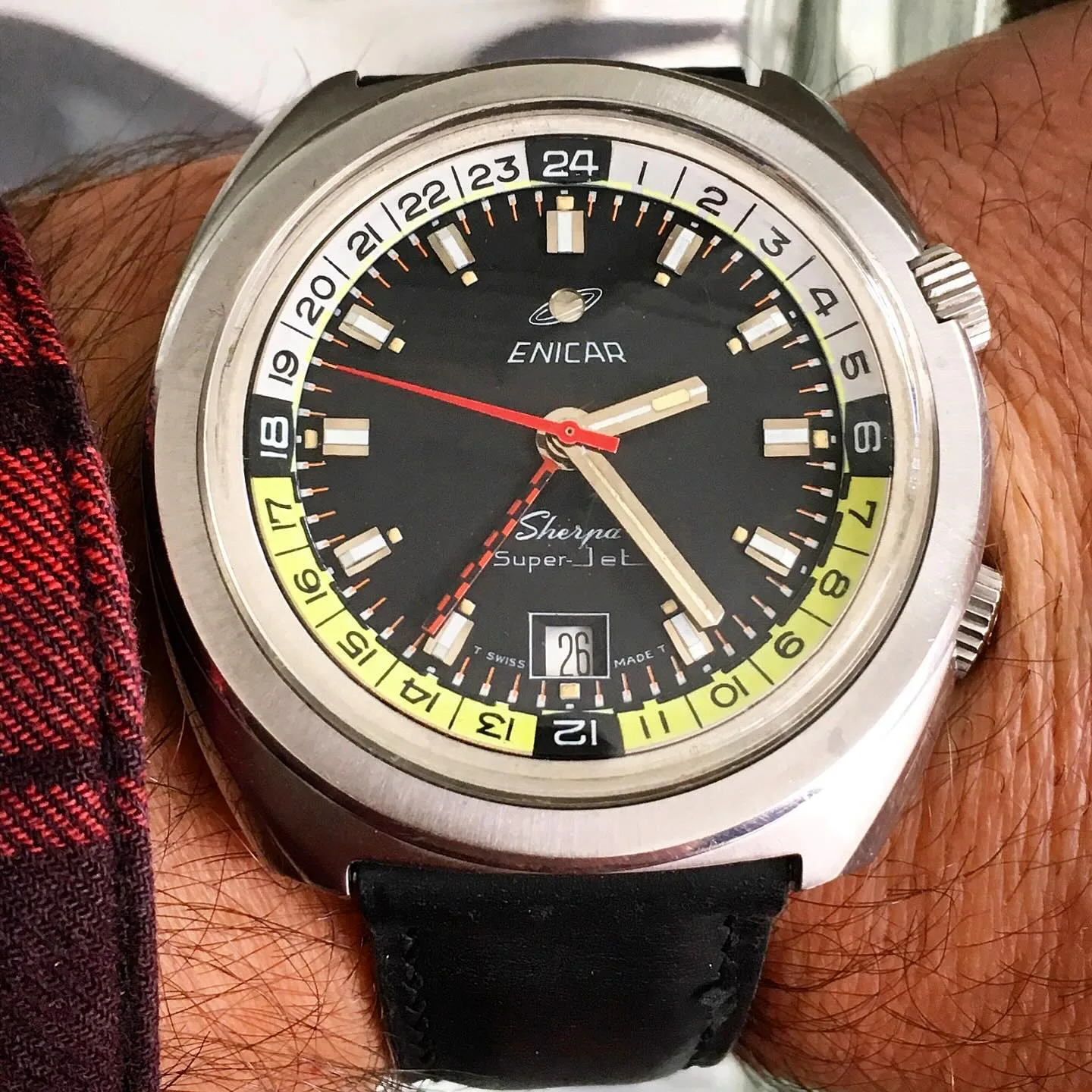 Sherpa Super-Jet in the cushion case with a black dial and black, white and yellow 24-hour bezel, on the wrist