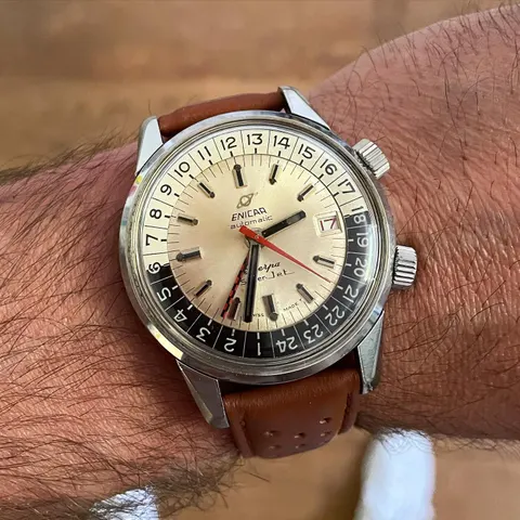 Sherpa Super-Jet with a silver dial, black and white 24-hour scale and red and black checkered GMT hand, on the wrist