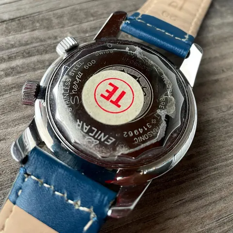 Caseback of a Sherpa Super-Jet with an engraved Sherpa medallion and a service sticker