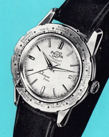 Period Enicar picture of a Sherpa Time with a white dial, date window and world-city outer bezel, on a black strap