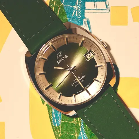 Enicar MRO Star Jewels with a green sunburst dial and date on a green leather strap